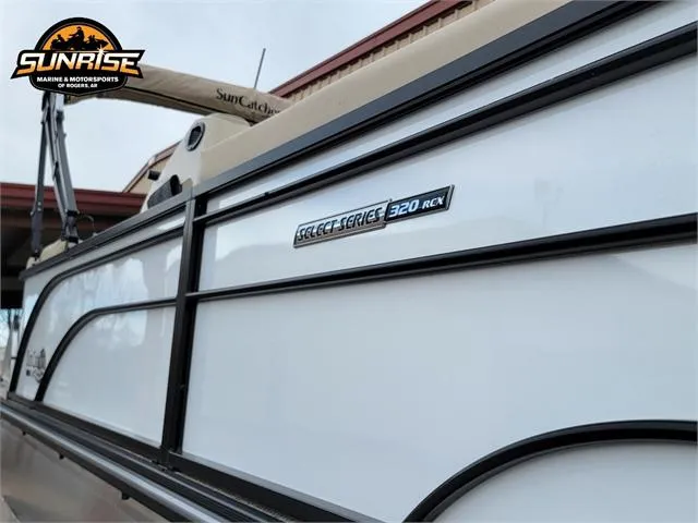 Slide: The Image of 2024 SunCatcher Select 320RCX boat side view with branding and logo. - 24