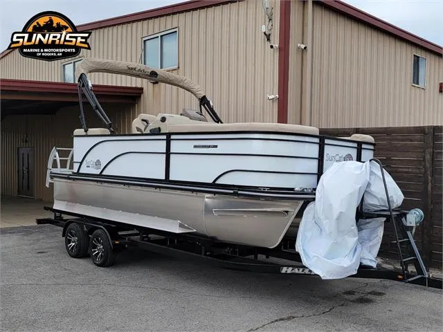 Slide: The Image of 2024 SunCatcher Select 320RCX pontoon boat on trailer outside Sunrise dealership. - 25