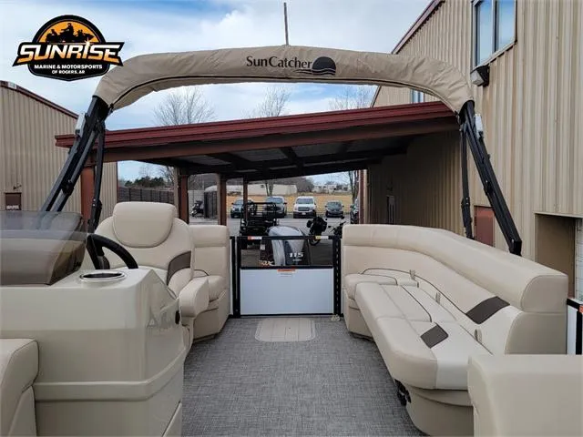 Slide: The Image of 2024 SunCatcher Select 320RCX pontoon boat with beige seating and canopy. - 3