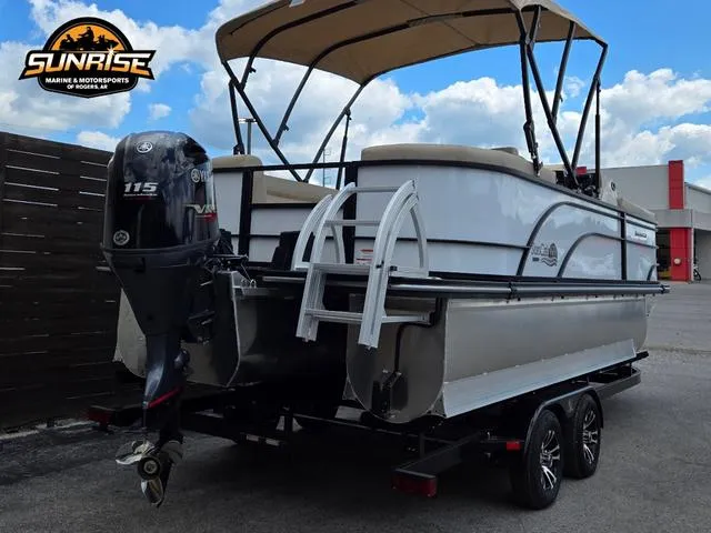 Slide: The Image of 2024 SunCatcher Select 320RCX pontoon boat with Yamaha 115 engine on trailer. - 30