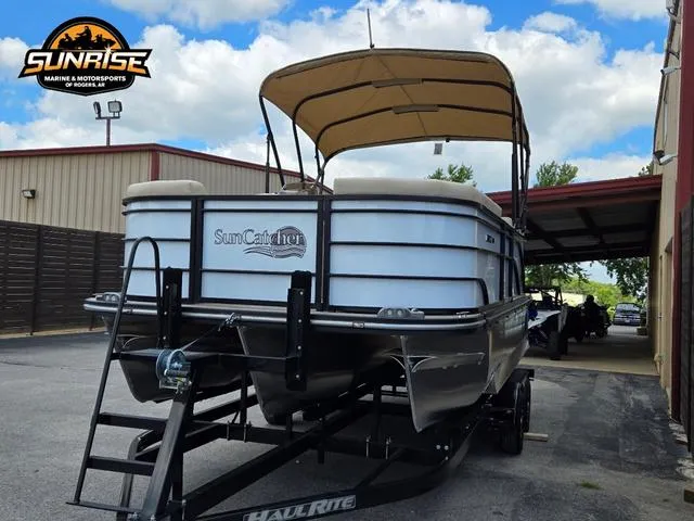 Slide: The Image of 2024 SunCatcher Select 320RCX pontoon boat on trailer at dealership. - 31
