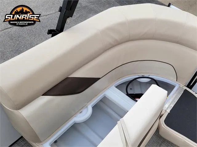 Slide: The Image of 2024 SunCatcher Select 320RCX boat interior with beige seating and storage compartments. - 7