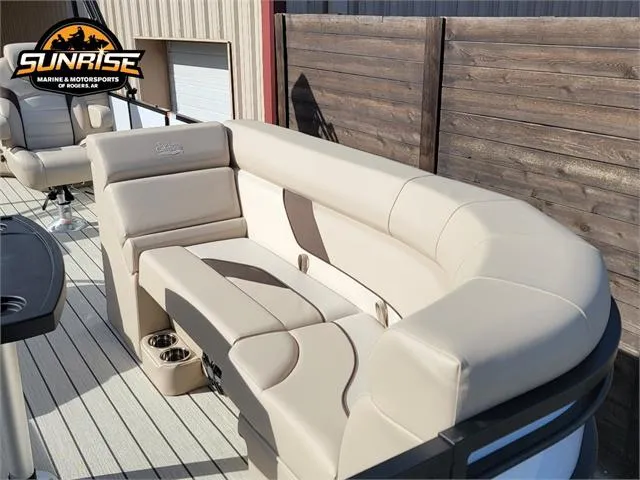Slide: The Image of 2024 SunCatcher Select 20RC boat with beige seating, docked at Sunrise Marine. - 10