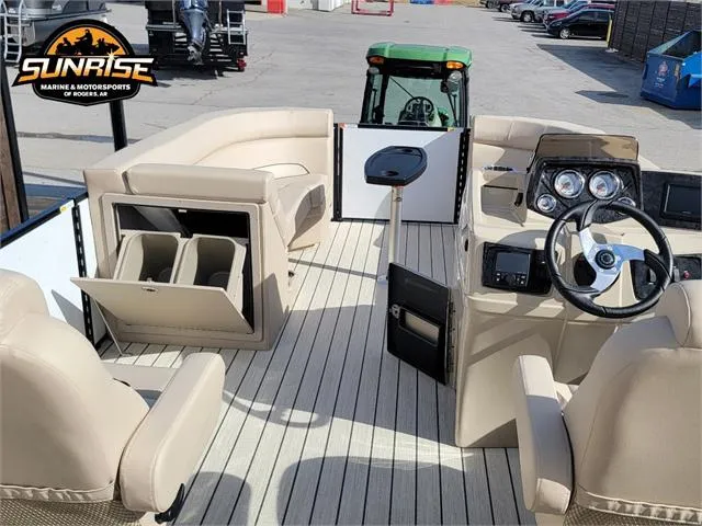 Slide: The Image of 2024 SunCatcher Select 20RC pontoon boat interior with beige seating and steering console. - 15