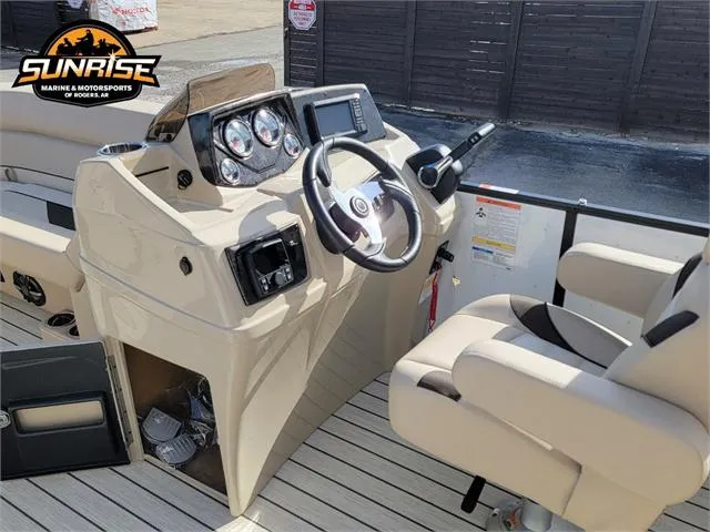 Slide: The Image of 2024 SunCatcher Select 20RC boat interior with steering wheel and control panel. - 16