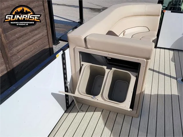 Slide: The Image of 2024 SunCatcher Select 20RC boat with beige seating and built-in storage bins. - 17