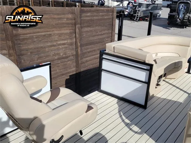 Slide: The Image of 2024 SunCatcher Select 20RC boat interior with beige seating and wooden deck. - 18