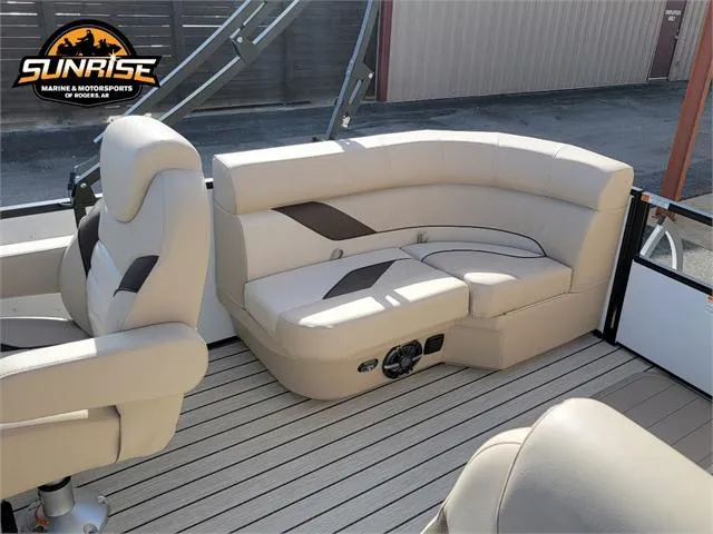 Slide: The Image of 2024 SunCatcher Select 20RC boat interior with beige seating and wood flooring. - 21