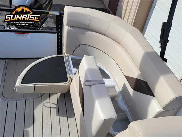 Slide: The Image of 2024 SunCatcher Select 20RC boat interior with beige seating and storage compartment. - 24