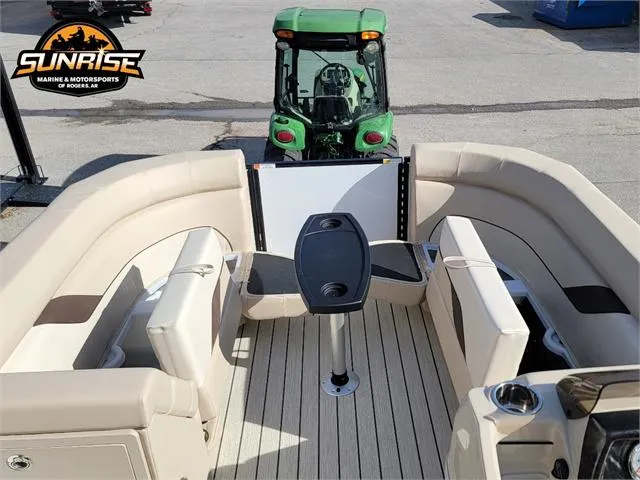 Slide: The Image of 2024 SunCatcher Select 20RC pontoon boat interior with seating and table, Sunrise Marine logo visible. - 26