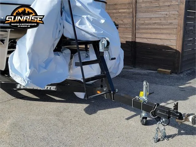 Slide: The Image of 2024 SunCatcher Select 20RC boat trailer with cover, parked outdoors. - 8