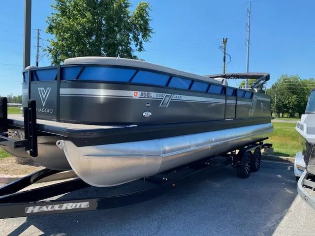 Slide: The Image of 2022 Viaggio Lago S L25S boat interior with modern seating and steering console. - 12