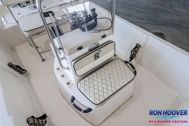 Slide: The Image of 2020 Carolina Skiff 178 boat interior with cushioned seating and console, Ron Hoover Marine branding. - 17