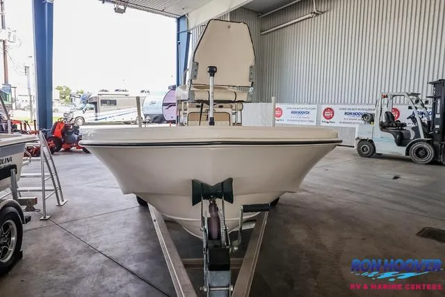 Slide: The Image of 2020 Carolina Skiff 178 boat on trailer in a showroom. - 2