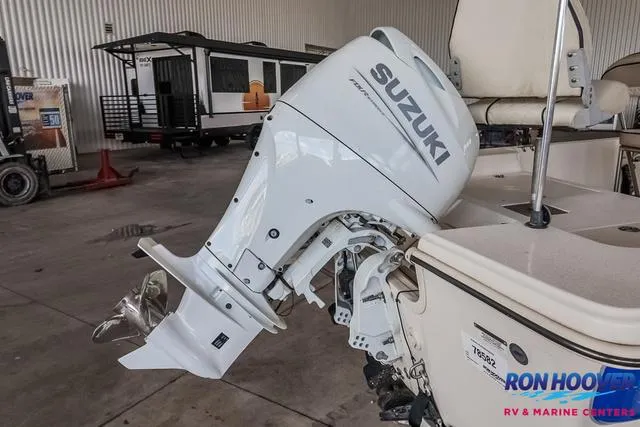 Slide: The Image of 2020 Carolina Skiff 178 with Suzuki outboard motor in a showroom. - 22