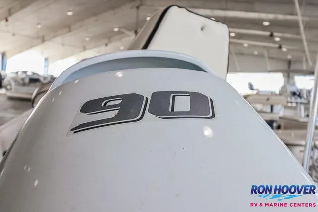 Slide: The Image of Close-up of a 2020 Carolina Skiff 178 boat engine with "90" decal. - 23