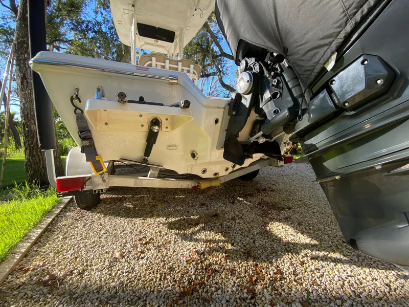 Slide: The Image of 2017 Key West 230 Bay Reef boat on gravel driveway, rear view. - 12