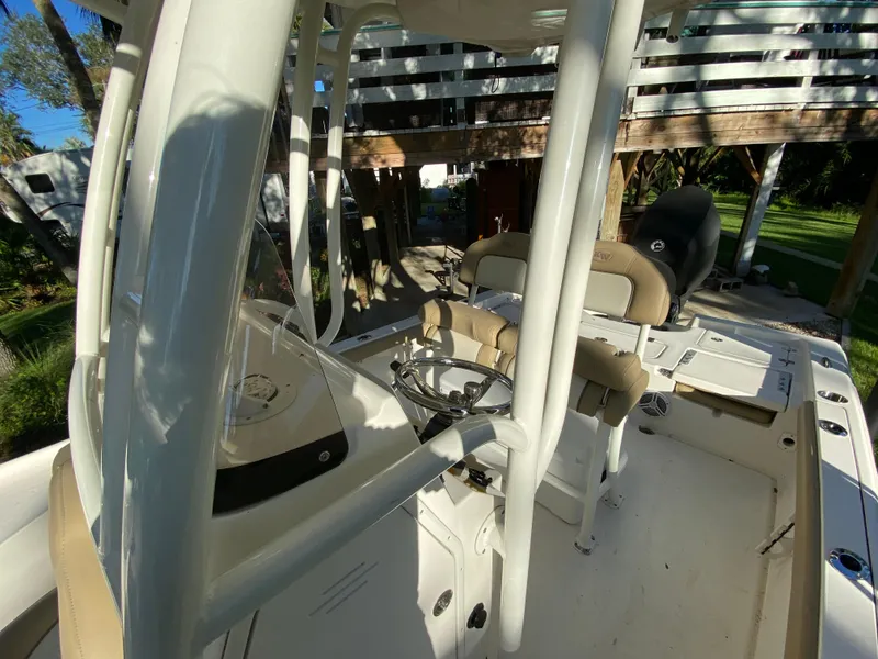 Slide: The Image of 2017 Key West 230 Bay Reef boat interior with seating and steering console. - 25