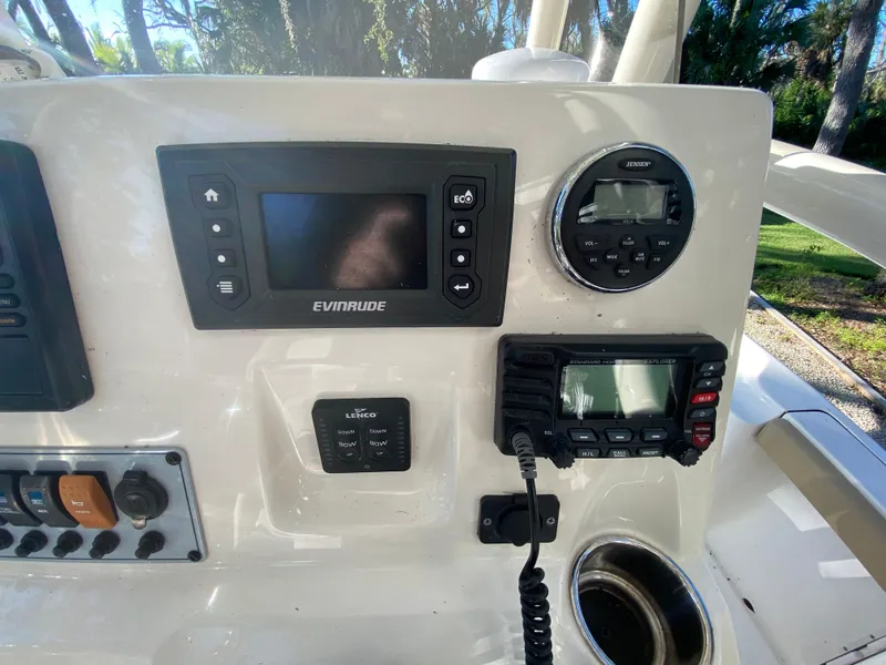 Slide: The Image of Control panel of 2017 Key West 230 Bay Reef boat with navigation and communication devices. - 30