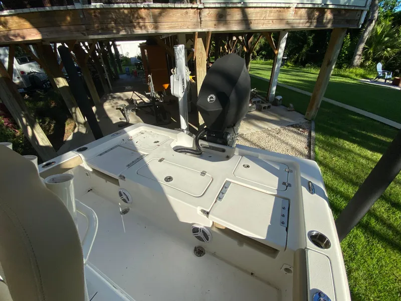 Slide: The Image of 2017 Key West 230 Bay Reef boat, outdoor view, under wooden deck. - 31