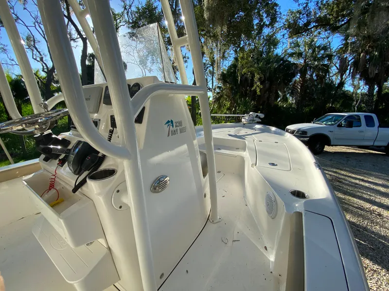 Slide: The Image of 2017 Key West 230 Bay Reef boat with white interior, parked near a white truck. - 42
