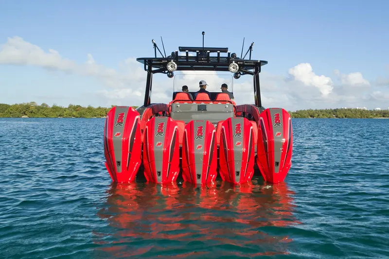 Slide: The Image of 2021 Midnight Express 43' Solstice with six red outboard engines on water. - 11