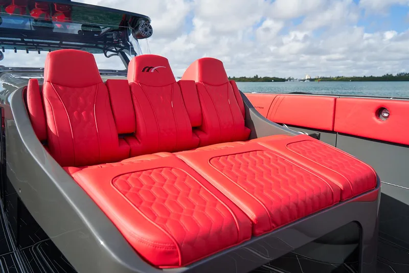 Slide: The Image of Red seating on 2021 Midnight Express 43' Solstice boat, ocean view. - 13