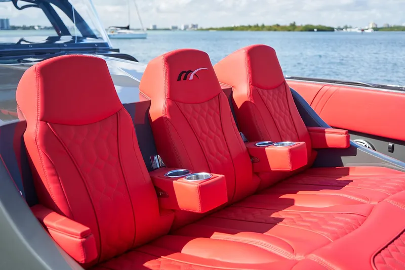 Slide: The Image of Red leather seats on 2021 Midnight Express 43' Solstice boat, ocean view. - 14