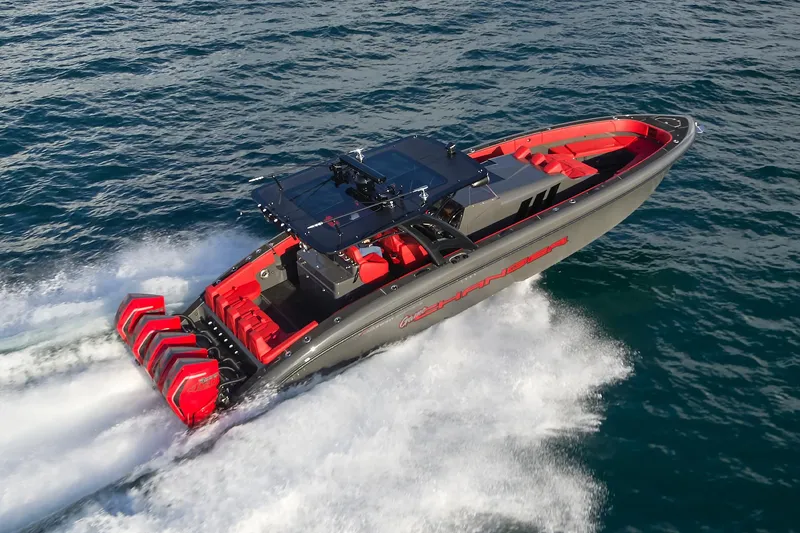 Slide: The Image of 2021 Midnight Express 43' Solstice speedboat cruising on open water, featuring sleek design and powerful engines. - 2