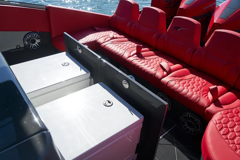 Slide: The Image of Luxurious red seating on 2021 Midnight Express 43' Solstice boat interior. - 23