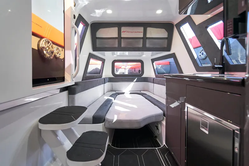 Slide: The Image of Luxurious interior of 2021 Midnight Express 43' Solstice boat with modern seating and kitchenette. - 28