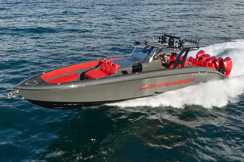 Slide: The Image of 2021 Midnight Express 43' Solstice boat cruising on open water, featuring sleek design and red accents. - 4