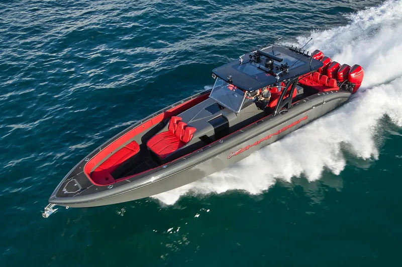 Slide: The Image of Midnight Express 43' Solstice 2021 speedboat cruising on open water with red accents. - 5