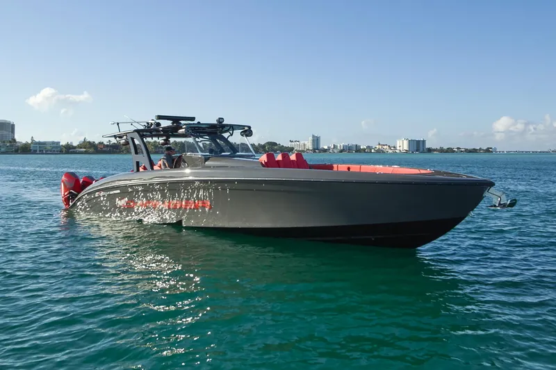 Slide: The Image of 2021 Midnight Express 43' Solstice boat on clear blue water, sunny day. - 7