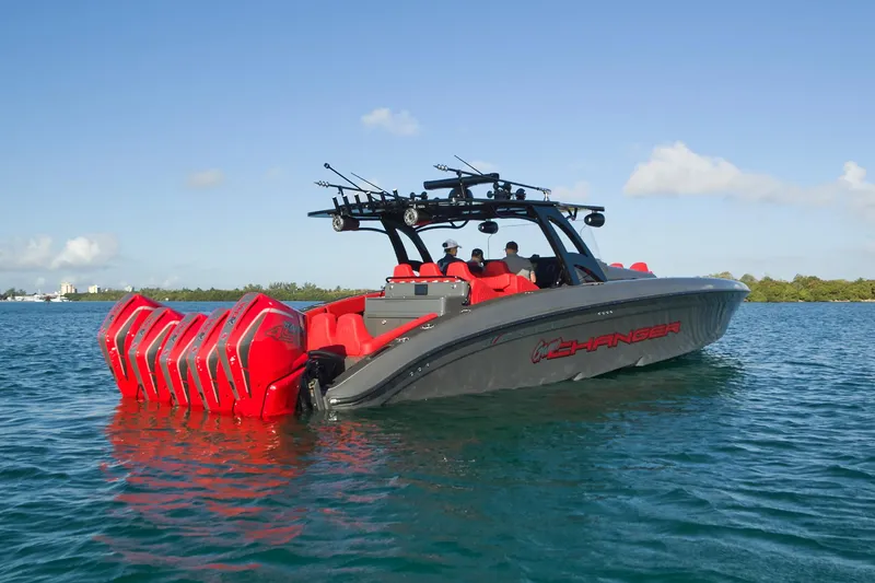 Slide: The Image of 2021 Midnight Express 43' Solstice boat with multiple red engines on calm water. - 9