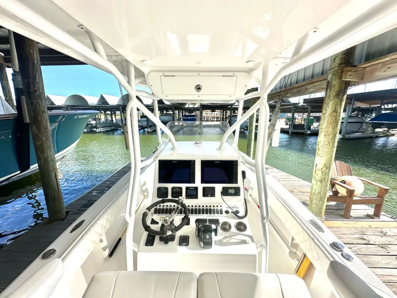 Slide: The Image of 2022 Ocean Runner 29 Center Console boat interior at marina dock. - 19