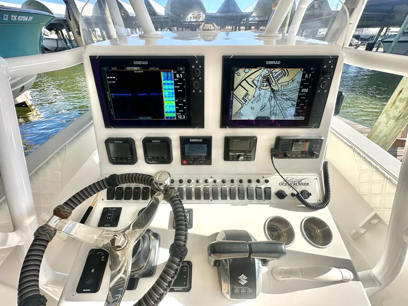 Slide: The Image of 2022 Ocean Runner 29 Center Console dashboard with navigation screens and controls. - 20