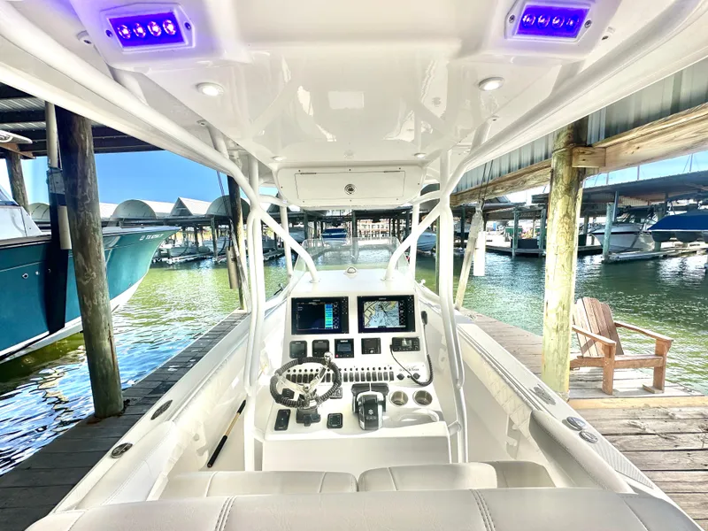 Slide: The Image of 2022 Ocean Runner 29 Center Console boat interior at marina dock. - 21