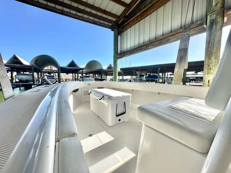 Slide: The Image of 2022 Ocean Runner 29 Center Console boat interior under marina canopy. - 26