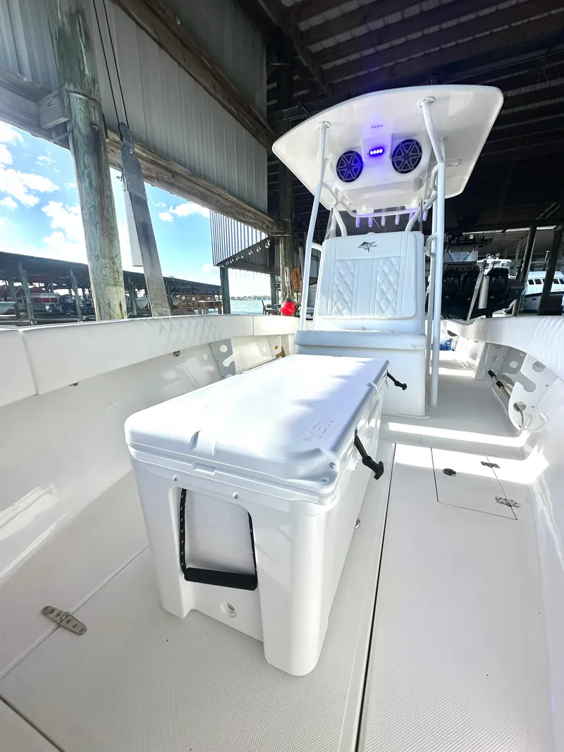 Slide: The Image of 2022 Ocean Runner 29 Center Console boat with spacious deck and modern console. - 29