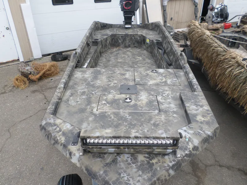 Slide: The Image of Excel 1754 Eclipse 2025 boat with camouflage design and LED light bar. - 2