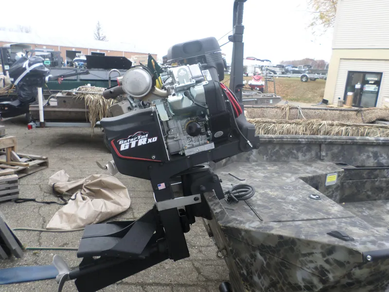 Slide: The Image of Excel 1754 Eclipse 2025 boat with Gator-Tail GTR XD motor in outdoor setting. - 4