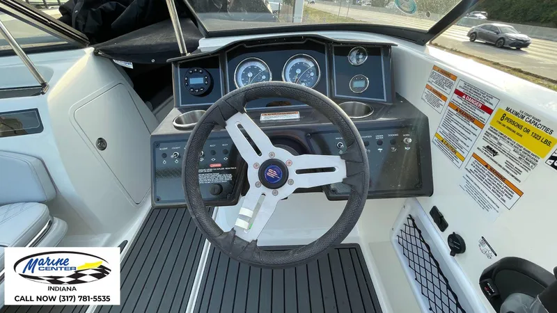 Slide: The Image of 2024 Bayliner VR5 boat dashboard with steering wheel and control panel. - 10