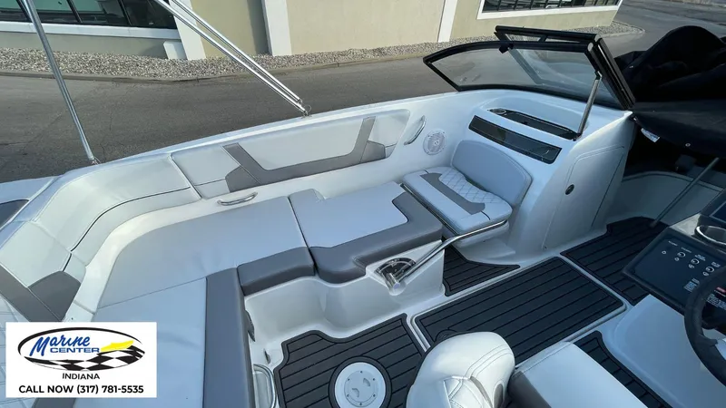 Slide: The Image of 2024 Bayliner VR5 boat interior with sleek seating and modern dashboard design. - 15