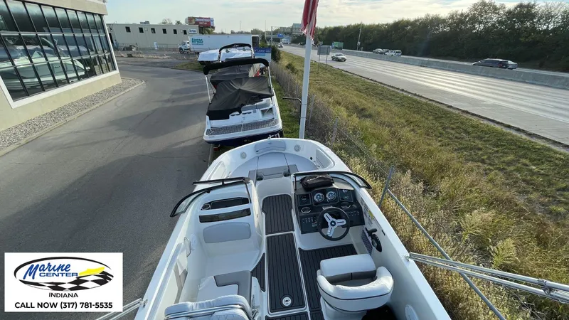 Slide: The Image of 2024 Bayliner VR5 boat displayed at Marine Center, Indiana, near highway. - 19