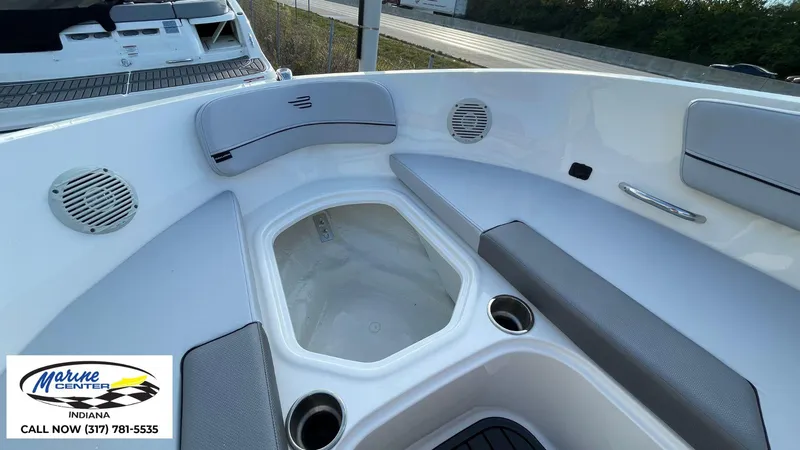 Slide: The Image of 2024 Bayliner VR5 boat interior with seating and speakers, Marine Center Indiana contact info visible. - 8