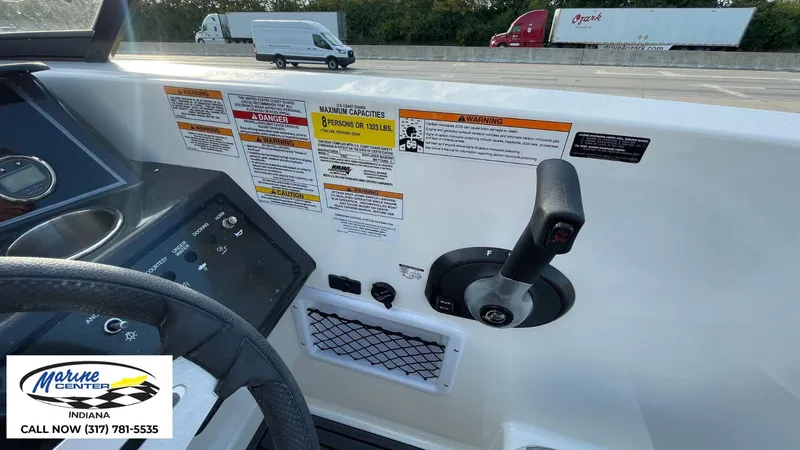 Slide: The Image of 2024 Bayliner VR5 boat dashboard with control lever and safety warnings. - 24