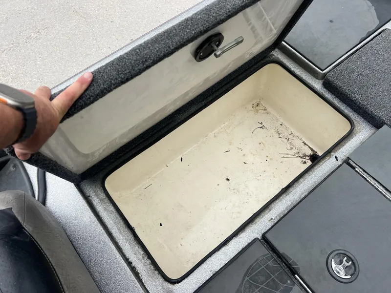 Slide: The Image of Open storage compartment in 2009 Ranger 208 VX boat. - 13