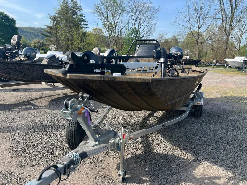 Slide: The Image of 2025 G3 Gator Tough 18 CCJ boat on trailer, parked outdoors. - 11