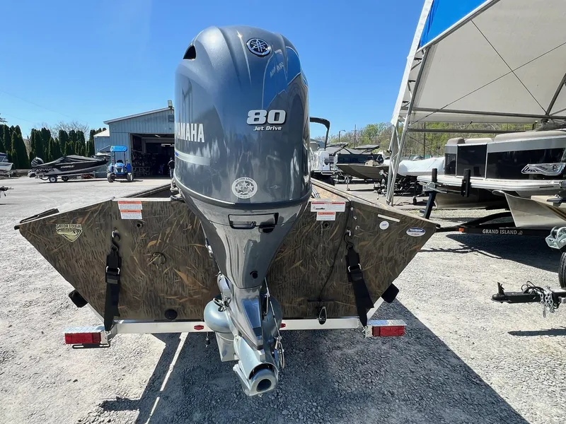 Slide: The Image of 2025 G3 Gator Tough 18 CCJ boat with Yamaha 80 Jet Drive engine, parked outdoors. - 14